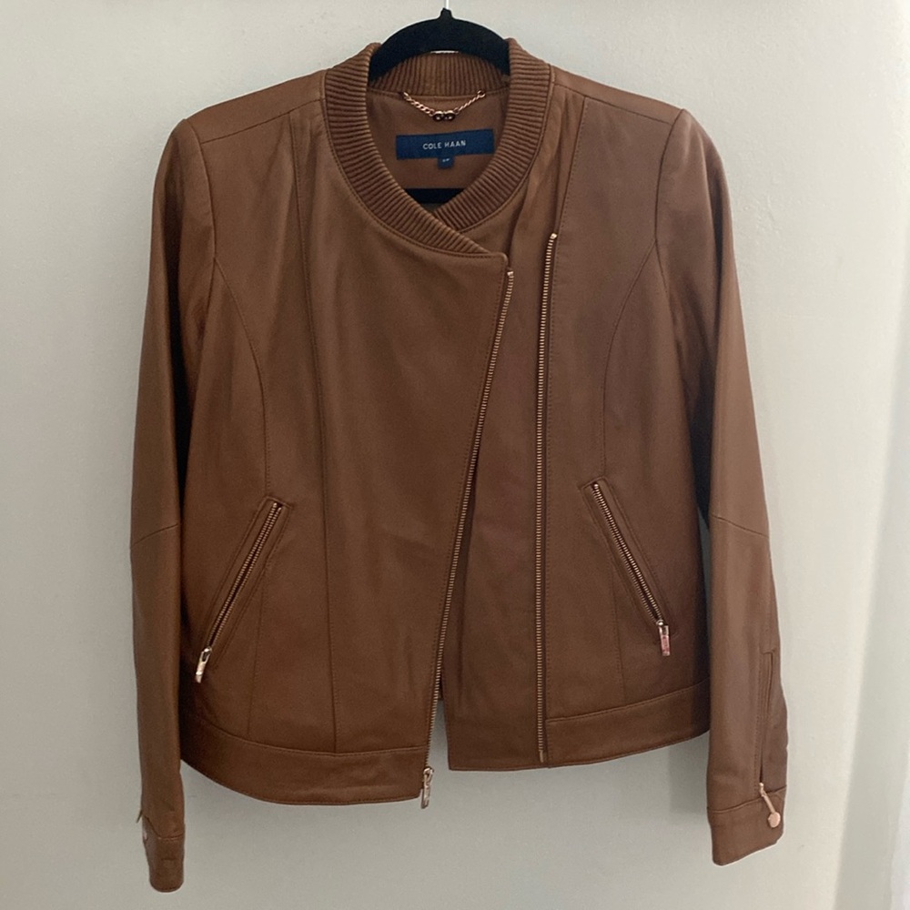 Brown Cole Haan Leather Jacket. (Worn twice). Doesn’t fit anymore.